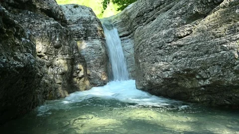 Beautiful waterfall in between rocks in the mountain. Stock Footage 211493641