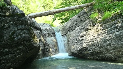 Beautiful waterfall in between rocks in the mountain. Stock Footage 211495687