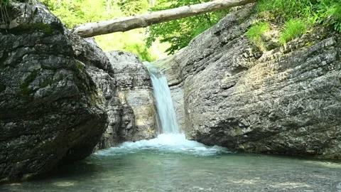 Beautiful waterfall in between rocks in the mountain. Video stock 211496141