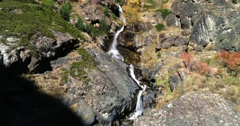 Beautiful waterfall between rocks on a mountainside Video stock 147101370