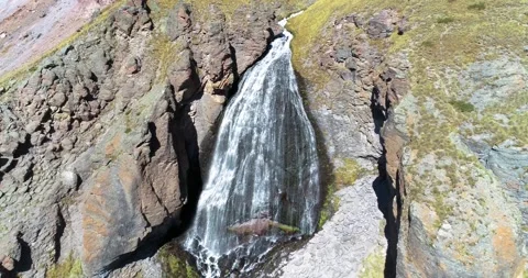 Beautiful waterfall between rocks on a mountainside Stock Footage 147101809