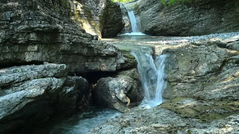 Beautiful waterfall between stones of a rivulet in the mountains Stock Footage 211491576