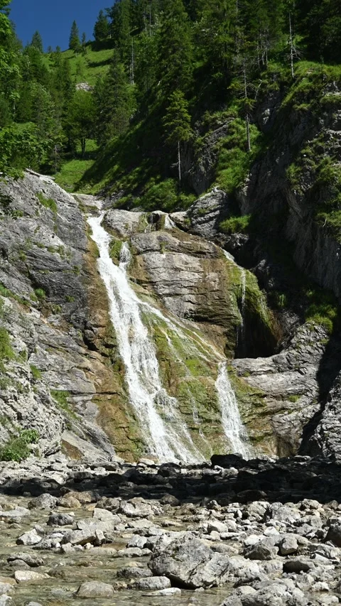 A beautiful waterfall called Glasbach Wasserfall in summer, vertical footage Video stock 260874286
