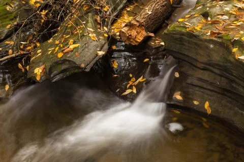 Beautiful waterfall cascade and fall foliage Stock Photos