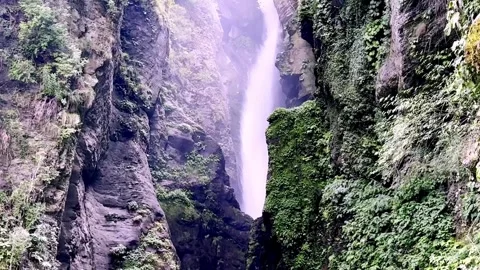 Beautiful Waterfall Cascading Through Scenic Natural Landscape Видео 339528533