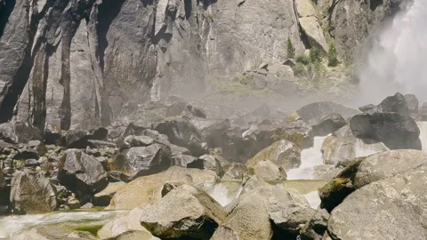 A beautiful waterfall from a close distance falling among stone rocks. The Stock Footage 219671917