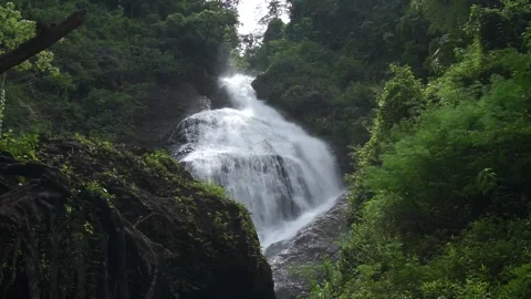 A beautiful waterfall in the daytime Видео 296735128
