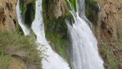 Beautiful waterfall falling into the sea. Big Waterfall. Stock Footage 155002500