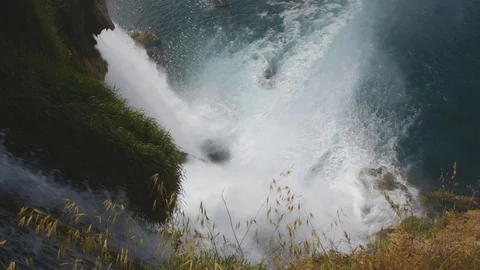 Beautiful waterfall falling into the sea Stock Footage 77911631