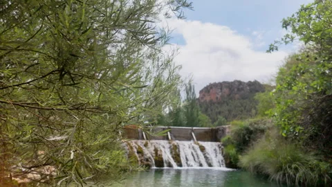 A beautiful waterfall is flowing into a river Stock Footage 277410003
