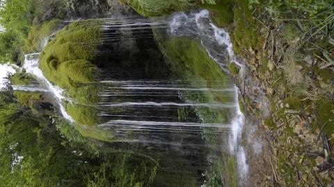 Beautiful waterfall in the forest - vertical video	 Stock Footage 111430662