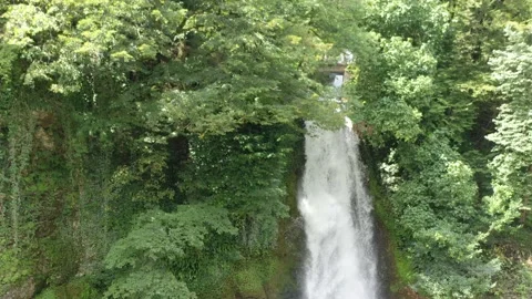 Beautiful waterfall in the forest, view from the drone Stock Footage 151188683
