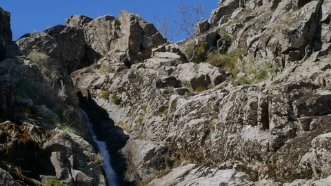 Beautiful waterfall in Jerte valley pan down Video stock 108263518