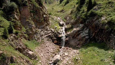 A beautiful waterfall in a mountain gorge. Stock Footage 209593679