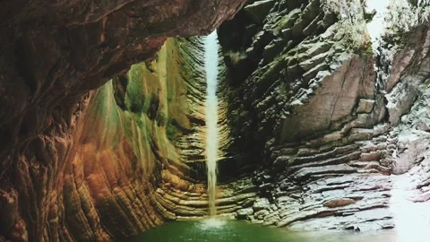 Beautiful waterfall in a mountain gorge Stock Footage 217536659