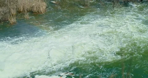 A beautiful waterfall in the mountains, because of the flood, the trees flooded Stock Footage 152284548