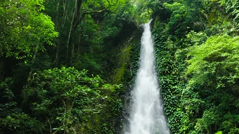 A beautiful waterfall in the mountains Stock Footage 235751764