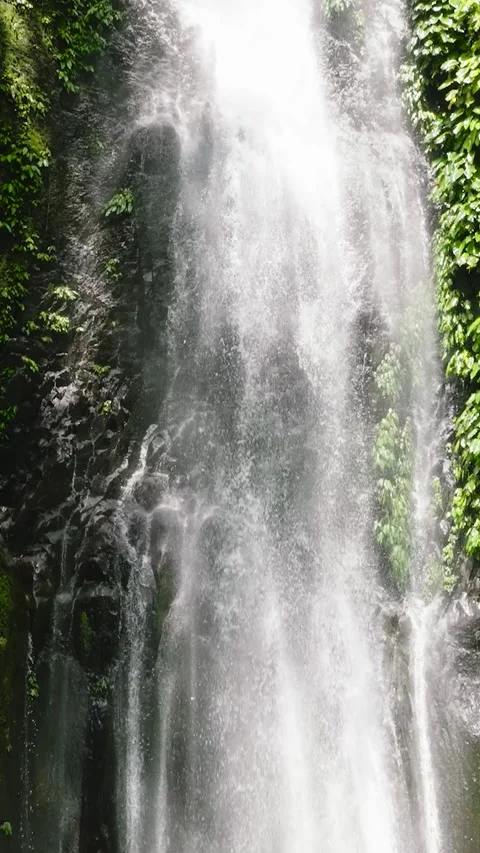 A beautiful waterfall in the mountains Stock Footage 325921392