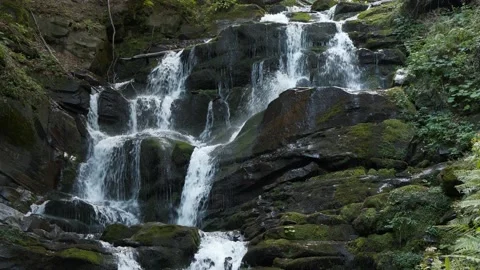 Beautiful waterfall in mountains. Reverse time video Video stock 143425211
