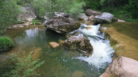Beautiful waterfall in the natural area of the Riera de Merles Stock Footage 266671853