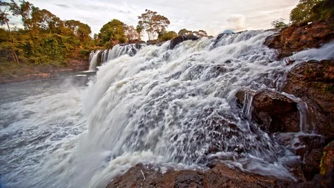 Beautiful waterfall panoramic sunset view slow motion seamless loop Stock Footage 101311496