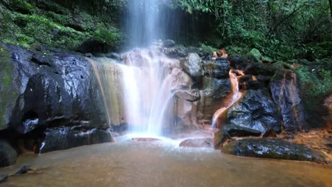 Beautiful waterfall in the remote fores Stock Footage 223710831
