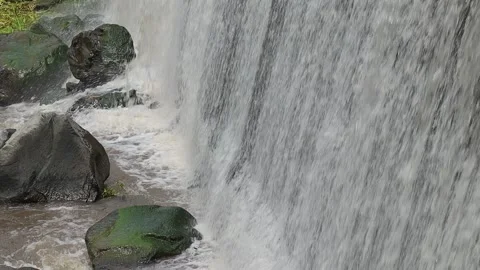 Beautiful waterfall with rocks under it with pan Stock-Footage 140614918