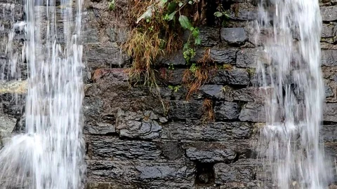 A Beautiful Waterfall on a Rocks wall Stock Footage 111856811