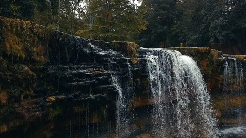 Beautiful waterfall in a summer forest. Stock Footage 94490574