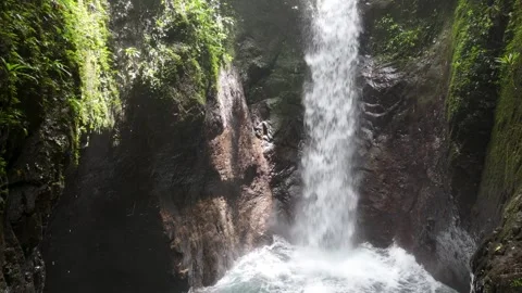 Beautiful waterfalls hidden between mountains, turquoise waters surrounded by Stock Footage 343892619