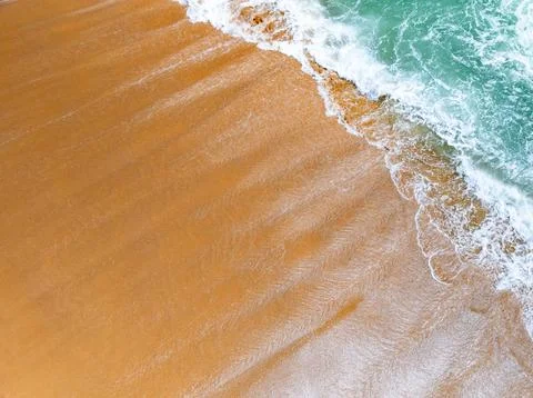 Beautiful wave crashing on sandy shore at beach in phuket thailand 스톡 사진