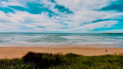 Beautiful waves and beach under blue sky at Wollongong North Beach, Sydney Stock Footage 177888533