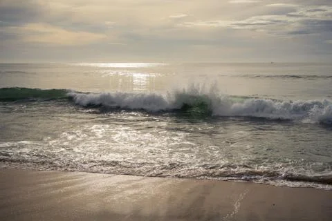Beautiful waves and clouds over the sea Stock Photos