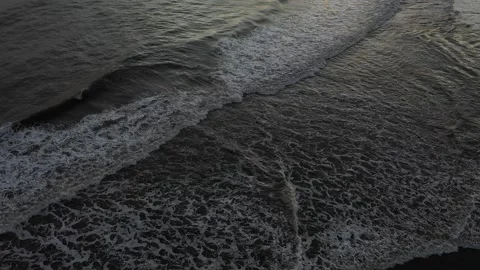 Beautiful waves on the beach at sunset Stock Footage 233943943