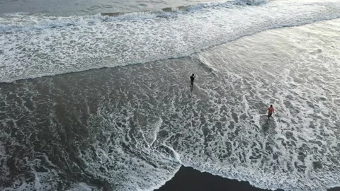 Beautiful waves on the beach at sunset Stock Footage 233943953