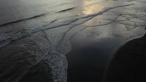 Beautiful waves on the beach at sunset Stock Footage 233943955