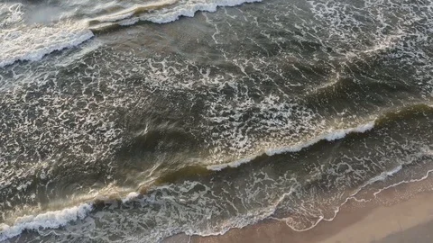 Beautiful waves breaking on the shore of Baltic sea sandy coast Stock Footage 116253778