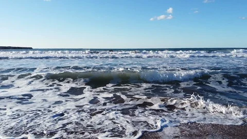 Beautiful waves of Cyprus wash the sandy beach at sunset day Stock Footage 124649457