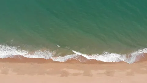 Beautiful waves do not end frames one by one while the turquoise sea waves break Stock Footage 137921811