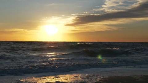 Beautiful Waves Flowing Into Sandy Beach During Sunrise in Melbourne, FL Stock Footage 104660029