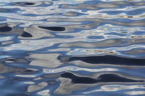 Beautiful waves of the river stretching to infinity Stock Photos