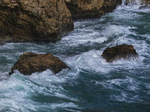 Beautiful waves on the rocks Stock Photos