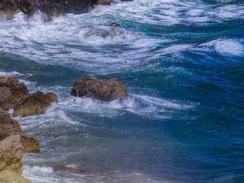 Beautiful waves on the rocks Stock Photos