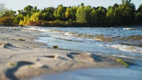 Beautiful waves roll over the river beach. Close up shot 스톡 동영상 250155608