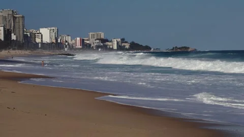 Beautiful waves roll onto a sandy beach in downtown Rio de Janeiro, Brazil Stock Footage 301240755