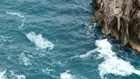 Beautiful waves rolling onto the shore with crystal-clear water. Stock Footage 304667450