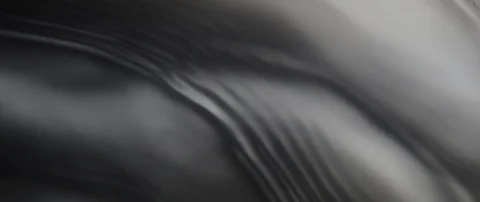 Beautiful waves run over the dark texture of the underlying water in slow motion Stock Footage 106002816