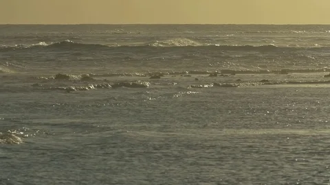 Beautiful waves on seascape during sunset Stock Footage 77803423