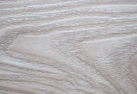 Beautiful wavy pattern of natural bleached wood close-up. Stock Photos