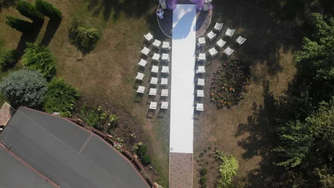 Beautiful wedding arch in a clearing drone view Vídeos de archivo 233738416